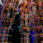 Quantum computer control racks with U.S. flag reflections, symbolizing Washington’s shift from research grants to direct equity stakes in quantum technology firms.