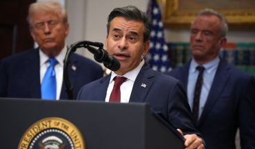 President Donald Trump (L) and Health and Human Services Secretary Robert F. Kennedy Jr. (R) look on as Food and Drug Administration Commissioner Dr. Marty Makary (C) delivers remarks during an announcement by President Donald Trump on “significant medical and scientific findings for America’s children” in the Roosevelt Room of the White House on September 22, 2025 in Washington, DC