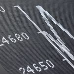 A display showing the German Stock Market Index DAX is pictured at the stock exchange in Frankfurt, western Germany, on October 9, 2025. Frankfurt's DAX index of blue-chip German companies opened at a record high on October 9, 2025 as investors shrugged off political and fiscal uncertainty in the United States and Europe.