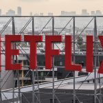n an aerial view, the Netflix logo is displayed above Netflix corporate offices on October 7, 2025 in Los Angeles, California