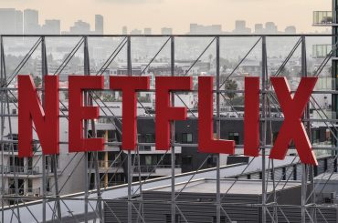 n an aerial view, the Netflix logo is displayed above Netflix corporate offices on October 7, 2025 in Los Angeles, California