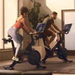 Hotel fitness center featuring Peloton equipment under Precor integration