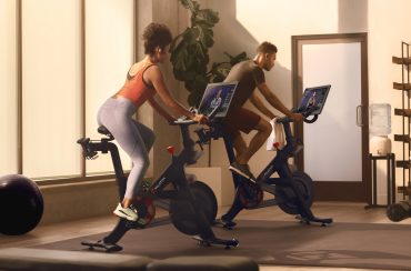 Hotel fitness center featuring Peloton equipment under Precor integration