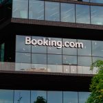 Exterior of Booking.com headquarters in Amsterdam, Netherlands. Booking Holdings posts $9B in Q3 as Connected Trip bundling, disciplined marketing, and platform scale drive durable growth.