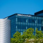 Exterior view of Dell Technologies headquarters building with corporate logo displayed prominently on a modern glass facade.