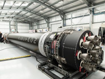 Electron rocket stage inside a Rocket Lab hangar during pre-launch integration and inspection.