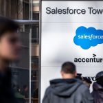 Salesforce headquarters exterior with branded signage as employees pass through the main entryway, as Salesforce posts $10.3B Q3 revenue.