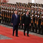 Xi Jinping and Emmanuel Macron meet in Beijing to discuss trade relations and market access.