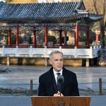 Mark Carney addresses the media at a press conference in Beijing on January 16, 2026.