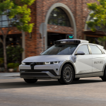 Waymo autonomous vehicle in a city after securing $16B to expand autonomous driving operations.