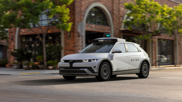 Waymo autonomous vehicle in a city after securing $16B to expand autonomous driving operations.