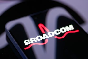 Broadcom logo as Broadcom AI revenue doubles to $8.4B, driven by hyperscaler custom silicon demand and VMware hybrid-cloud AI growth.