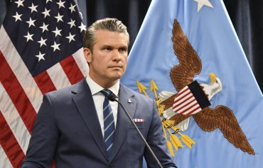 U.S. Defense Secretary Pete Hegseth as Anthropic takes the Pentagon to court over AI ethics and the blacklisting of its Claude AI system.