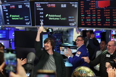 Robinhood CEO Vlad Tenev celebrates at the New York Stock Exchange as the Robinhood venture fund begins trading, opening private tech investments to retail investors.