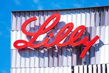 Eli Lilly headquarters as Lilly Insilico deal advances AI drug discovery and pharmaceutical AI strategy