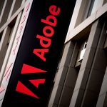 Adobe headquarters entrance and corporate signage in San Jose as the company announces strong Adobe Q1 2026 earnings, rising Creative Cloud revenue and accelerating adoption of Firefly generative AI tools.