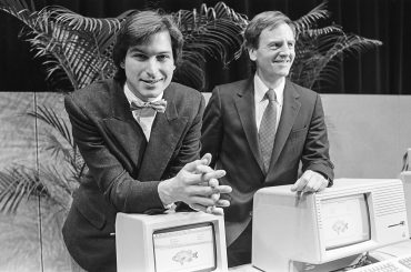 Steve Jobs and John Sculley at Apple in 1984 as Apple 50 years reflects early platform strategy, product design, and the origins of the Apple ecosystem