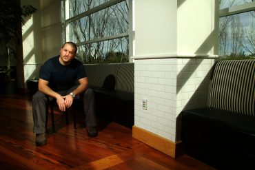 Jonathan Ive at Apple headquarters in 2004 as Apple 50 years reflects product design, platform strategy, and the development of the Apple ecosystem