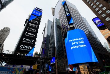 CoreWeave Times Square signage representing CoreWeave Q1 2026 revenue growth, AI infrastructure expansion, GPU cloud infrastructure, hyperscale AI compute demand, NVIDIA AI infrastructure, and large-scale AI data centre growth across the global cloud computing market
