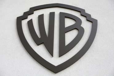 Warner Bros. Discovery headquarters and HBO Max streaming platform illustrating WBD Q1 2026 earnings, streaming growth, studio revenues, and media transformation