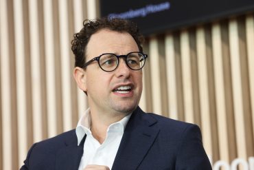 Anthropic CEO Dario Amodei as the company closes a $65 billion Series H funding round at a $965 billion valuation amid rapid Claude adoption and enterprise AI growth.