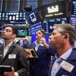 Traders on the New York Stock Exchange representing the April jobs report, U.S. labor market, Federal Reserve expectations, and nonfarm payroll growth