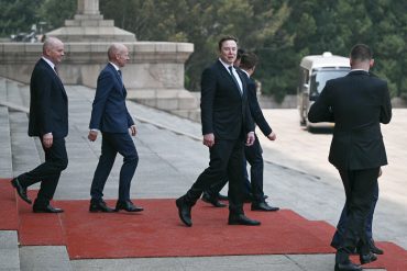 Tesla and SpaceX CEO Elon Musk arrives at the Great Hall of the People during the Trump China visit 2026 as U.S.-China trade talks and AI infrastructure negotiations continue in Beijing.