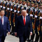 U.S. President Donald Trump reviews an honor guard alongside Chinese President Xi Jinping during the Trump Xi Beijing summit as U.S.-China trade talks, rare earth negotiations, AI competition, and semiconductor policy discussions dominate the agenda.