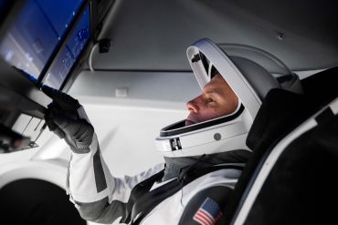 SpaceX Crew mission pilot prepares for launch operations as SpaceX advances reusable human spaceflight, Starship development, and orbital infrastructure ahead of its expected Nasdaq listing.