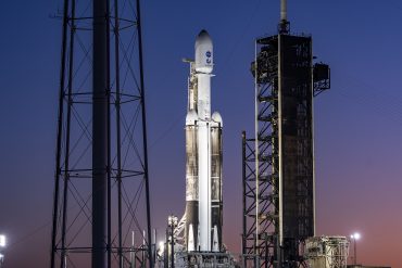 Europa Clipper spacecraft atop a SpaceX Falcon Heavy rocket as SpaceX expands launch dominance, Starlink infrastructure, and orbital economy ambitions.