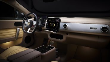 Interior design of the Ferrari Luce luxury electric vehicle featuring E-ink displays, tactile controls, and a minimalist grand touring cabin.