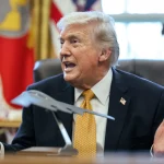 U.S. President Donald Trump speaks in the Oval Office as the administration advances a voluntary AI oversight framework for frontier AI models.