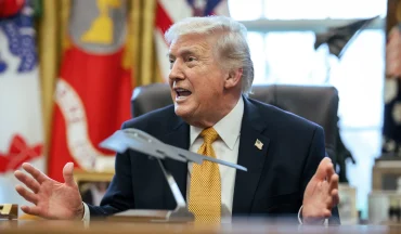U.S. President Donald Trump speaks in the Oval Office as the administration advances a voluntary AI oversight framework for frontier AI models.