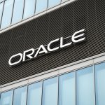 Oracle headquarters during Oracle layoffs and Oracle AI layoffs, highlighting AI job cuts, Oracle restructuring, Oracle 10-K disclosures, and cloud investment.