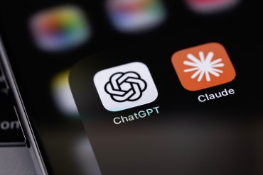 ChatGPT and Claude mobile app icons displayed on a smartphone screen, highlighting growing competition between OpenAI and Anthropic in the AI market.