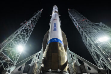 Blue Origin New Glenn rocket on the launch pad before liftoff, highlighting Blue Origin funding, Blue Origin valuation, New Glenn rocket, Jeff Bezos investment, space infrastructure, and outside investors.
