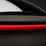 Tesla Model YL with Tesla logo representing Tesla Q2 earnings, record revenue, electric vehicles and AI investment.
