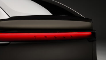 Tesla Model YL with Tesla logo representing Tesla Q2 earnings, record revenue, electric vehicles and AI investment.