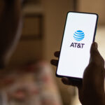 AT&T logo representing AT&T Q2 earnings, fiber broadband expansion, wireless convergence and the EchoStar spectrum acquisition.
