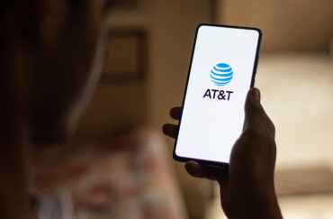 AT&T logo representing AT&T Q2 earnings, fiber broadband expansion, wireless convergence and the EchoStar spectrum acquisition.
