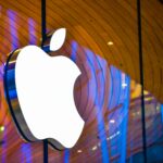 Apple Store facade with Apple logo representing Apple Q3 earnings, strong iPhone revenue performance, China weakness, services concerns, and rising memory costs affecting margins.