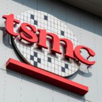 TSMC semiconductor manufacturing facility during Q2 earnings, showing the exterior of the company's advanced AI chip fabrication plant.
