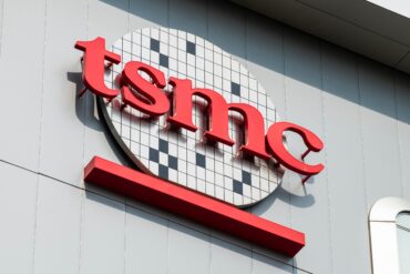 TSMC semiconductor manufacturing facility during Q2 earnings, showing the exterior of the company's advanced AI chip fabrication plant.