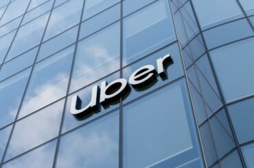 Uber corporate branding on the building representing the company's mobility and delivery platform following strong Q2 earnings, record Gross Bookings, Delivery Hero acquisition plans and continued investment in autonomous vehicle technology.