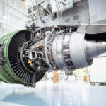 Aircraft engine turbine on a GE Aerospace factory floor, representing GE Aerospace Q3 earnings, commercial engine production, LEAP demand and aerospace manufacturing growth