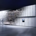 High NA EUV lithography system with two cleanroom engineers at a console, representing ASML Q3 earnings, record gross margin, AI-driven EUV demand and semiconductor capacity constraints