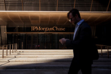 JPMorgan Chase headquarters in New York representing JPMorgan Q3 earnings, rising profit, surging equities trading, weaker FICC revenue, consumer banking strength and lower share buybacks
