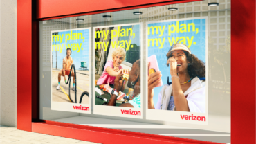 Verizon Store storefront with Verizon advertising posters, representing Verizon Q3 earnings, wireless subscriber growth, record margins, 5G services and higher 2026 guidance